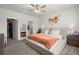 Bedroom with neutral decor, a ceiling fan, and an ensuite bathroom and walk-in closet at 223 Goshen Rd, Moncks Corner, SC 29461
