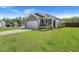 Charming home with a well-manicured lawn, gray siding, and an attached two-car garage at 223 Goshen Rd, Moncks Corner, SC 29461