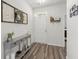 Inviting foyer featuring stylish gray console table and attractive wood-look floors at 223 Goshen Rd, Moncks Corner, SC 29461