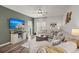 Living room showcasing neutral furniture, a ceiling fan, and decorative wall art at 223 Goshen Rd, Moncks Corner, SC 29461