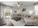 Living room featuring neutral colored furniture, natural light, and a ceiling fan at 223 Goshen Rd, Moncks Corner, SC 29461