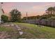 Large backyard with a stone path, a well-manicured lawn, and a privacy fence at 2242 Terrabrook Ln, Charleston, SC 29412