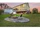 Beautiful backyard with a stone fire pit, perfect for outdoor relaxation and gatherings at 2242 Terrabrook Ln, Charleston, SC 29412