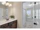 Bathroom featuring a sink with dark wood cabinets, a mirror, vanity lights, and a shower behind a curtain at 2242 Terrabrook Ln, Charleston, SC 29412