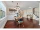 Elegant dining room featuring hardwood floors, stylish lighting, and a cozy seating area nearby at 2242 Terrabrook Ln, Charleston, SC 29412