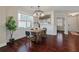 Bright and stylish dining room with hardwood floors, a modern light fixture, and a large window at 2242 Terrabrook Ln, Charleston, SC 29412