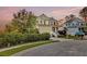 Charming two-story home with a welcoming front porch, manicured lawn, and serene neighborhood setting at 2242 Terrabrook Ln, Charleston, SC 29412