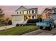 Charming two-story home with a well-manicured lawn and a classic, welcoming front porch at 2242 Terrabrook Ln, Charleston, SC 29412