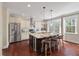 Modern kitchen with granite countertops, stainless steel appliances, and an island with bar seating at 2242 Terrabrook Ln, Charleston, SC 29412