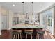Kitchen island featuring granite countertops, modern lighting, and seating for three at 2242 Terrabrook Ln, Charleston, SC 29412