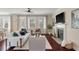 Bright living room features a fireplace and large windows, creating a cozy and inviting atmosphere at 2242 Terrabrook Ln, Charleston, SC 29412