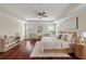 Luxurious primary bedroom with hardwood floors, stylish furnishings, and plenty of natural light at 2242 Terrabrook Ln, Charleston, SC 29412