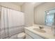 Bathroom features a vanity with a modern sink and a shower with a patterned curtain at 227 Oak View Way, Summerville, SC 29483
