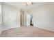 A neutral carpeted bedroom with two doors and great natural light from a window at 227 Oak View Way, Summerville, SC 29483