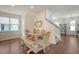 Bright dining area with a wooden table, bench seating, and a decorative rug under the table at 227 Oak View Way, Summerville, SC 29483