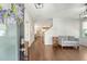 Bright entryway featuring hardwood floors, modern lighting, and stylish decor at 227 Oak View Way, Summerville, SC 29483