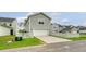 Home exterior with garage, white picket fence, and wide driveway offers great curb appeal at 227 Oak View Way, Summerville, SC 29483