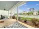 Inviting front porch with rocking chair and outdoor rug, perfect for relaxing at 227 Oak View Way, Summerville, SC 29483