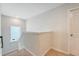Upper hallway with carpeted steps, a bright window, and a door leading to another room at 227 Oak View Way, Summerville, SC 29483