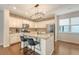 Well-equipped kitchen featuring a stylish island, stainless appliances, and brick accent wall at 227 Oak View Way, Summerville, SC 29483
