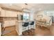 Modern kitchen featuring stainless steel appliances, a brick accent wall, and an island with counter seating at 227 Oak View Way, Summerville, SC 29483