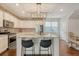Modern kitchen featuring an island, stainless steel appliances, and a brick backsplash at 227 Oak View Way, Summerville, SC 29483