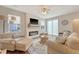 Cozy living room with a fireplace, comfortable seating, and a stylish rug at 227 Oak View Way, Summerville, SC 29483