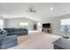 Spacious living room with vaulted ceilings, carpet, and a large sectional sofa at 227 Oak View Way, Summerville, SC 29483