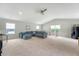 Bright, open living area with carpet flooring, a ceiling fan, and a comfortable sectional sofa at 227 Oak View Way, Summerville, SC 29483