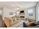 Inviting living room featuring modern fireplace, comfortable seating, and hardwood floors at 227 Oak View Way, Summerville, SC 29483