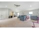 Large bonus room area with carpet and a large sectional, perfect for Gathering activities and relaxation at 227 Oak View Way, Summerville, SC 29483