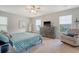 Cozy main bedroom featuring a bed, dresser, chair, and ample natural light from multiple windows at 227 Oak View Way, Summerville, SC 29483