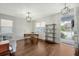 Well-lit home office with hardwood floors, a sleek desk, and plenty of natural light at 227 Oak View Way, Summerville, SC 29483