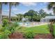 Inviting community pool surrounded by lush greenery, lounge chairs, and shaded seating areas at 227 Oak View Way, Summerville, SC 29483