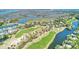 Breathtaking aerial view of a golf course community nestled amidst scenic waterways and lush landscapes at 26 Edgewater Aly, Isle of Palms, SC 29451