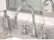 Close-up of a modern bathroom sink featuring a sleek faucet and marble countertop at 26 Edgewater Aly, Isle of Palms, SC 29451