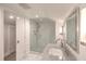 Bright bathroom with a glass enclosed shower, marble countertop, and white subway tile at 26 Edgewater Aly, Isle of Palms, SC 29451