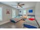Cozy bedroom featuring hardwood floors, a ceiling fan, and two twin beds at 26 Edgewater Aly, Isle of Palms, SC 29451