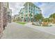 Charming walkway lined with colorful buildings and outdoor seating areas, creating a vibrant community atmosphere at 26 Edgewater Aly, Isle of Palms, SC 29451