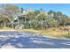 Charming two-story home with lush landscaping and a brick driveway at 26 Edgewater Aly, Isle of Palms, SC 29451
