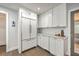 Well-organized kitchen with white cabinets, stainless steel appliances, and a clean, modern design at 26 Edgewater Aly, Isle of Palms, SC 29451