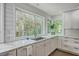The kitchen features a large window above the sink providing scenic views of the outdoors and allowing in natural light at 26 Edgewater Aly, Isle of Palms, SC 29451