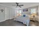Bright bedroom featuring hardwood floors, a ceiling fan, and white doors and trim at 26 Edgewater Aly, Isle of Palms, SC 29451