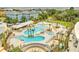 Aerial view of a resort-style pool area with multiple pools, lounge chairs, palm trees, and a poolside bar at 26 Edgewater Aly, Isle of Palms, SC 29451