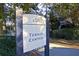 Sign for the Wild Dunes Tennis Center, promoting recreational opportunities within the community at 26 Edgewater Aly, Isle of Palms, SC 29451