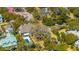 Stunning aerial view showcasing the property's pool and mature landscaping in a lovely neighborhood at 2629 Goldbug Ave, Sullivans Island, SC 29482