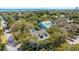 Scenic aerial shot of a luxurious property nestled among lush trees, showcasing a private pool at 2629 Goldbug Ave, Sullivans Island, SC 29482