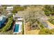 Picturesque aerial perspective of the home with pool, lush landscaping, and peaceful neighborhood setting at 2629 Goldbug Ave, Sullivans Island, SC 29482
