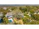 Expansive aerial view featuring the home's pool, lush greenery, and serene surroundings near the marsh at 2629 Goldbug Ave, Sullivans Island, SC 29482