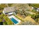 Beautiful aerial view of the home, highlighting the outdoor pool, entertainment area, and lush backyard at 2629 Goldbug Ave, Sullivans Island, SC 29482
